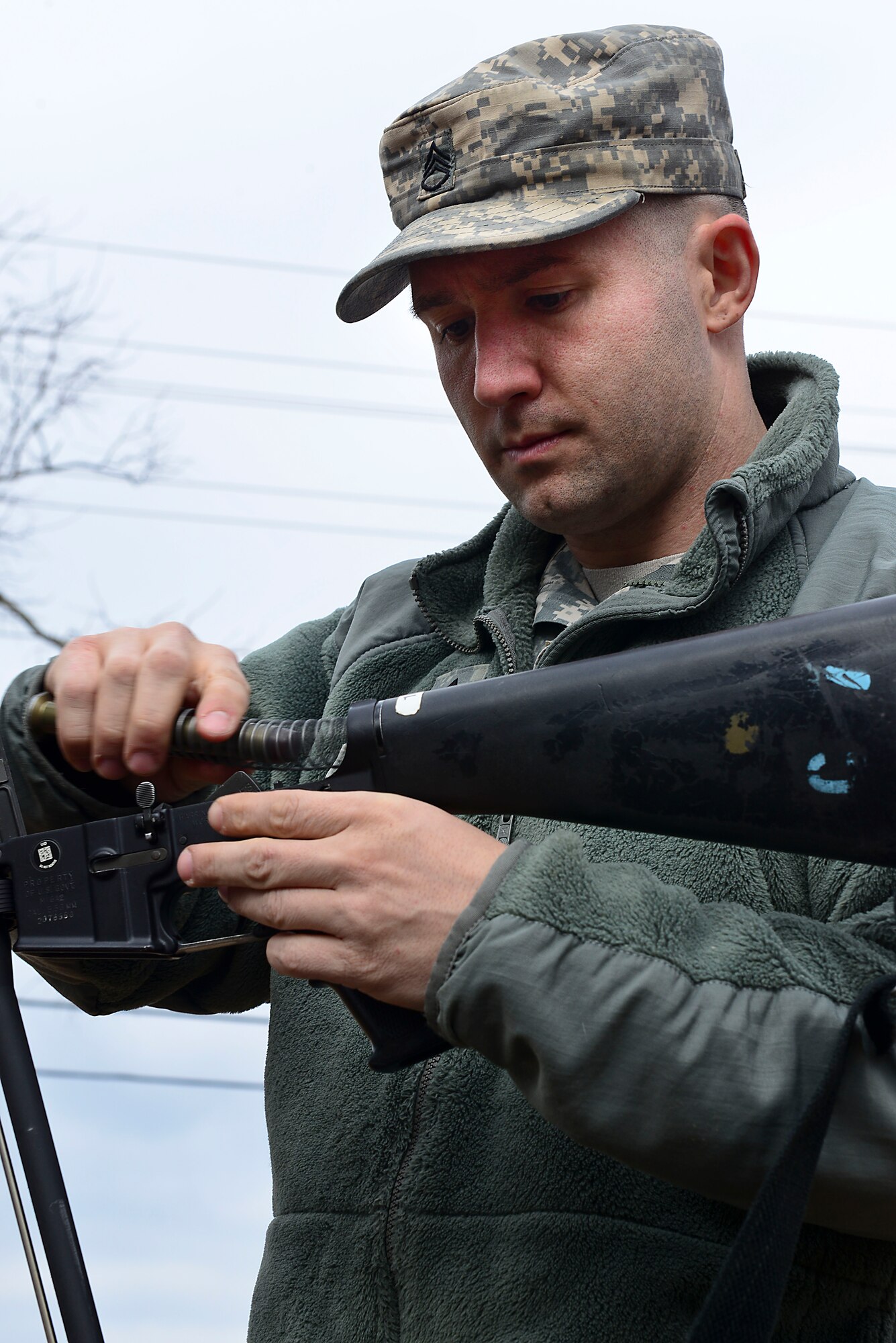 U.S. Army Staff Sgt. Thomas Featsent,  Bravo Company, 1st Battalion, 210th Aviation Regiment, 128th Aviation Brigade UH-60 Blackhawk maintenance instructor, assembles a weapon at Fort Eustis, Va., Feb. 11, 2015. Featsent performed the task as part of the annual 128th Avn. Bde. noncommissioned officer and Advanced Individual Training Platoon sergeant competition. (U.S. Air Force photo by Senior Airman Kimberly Nagle/Released) 
