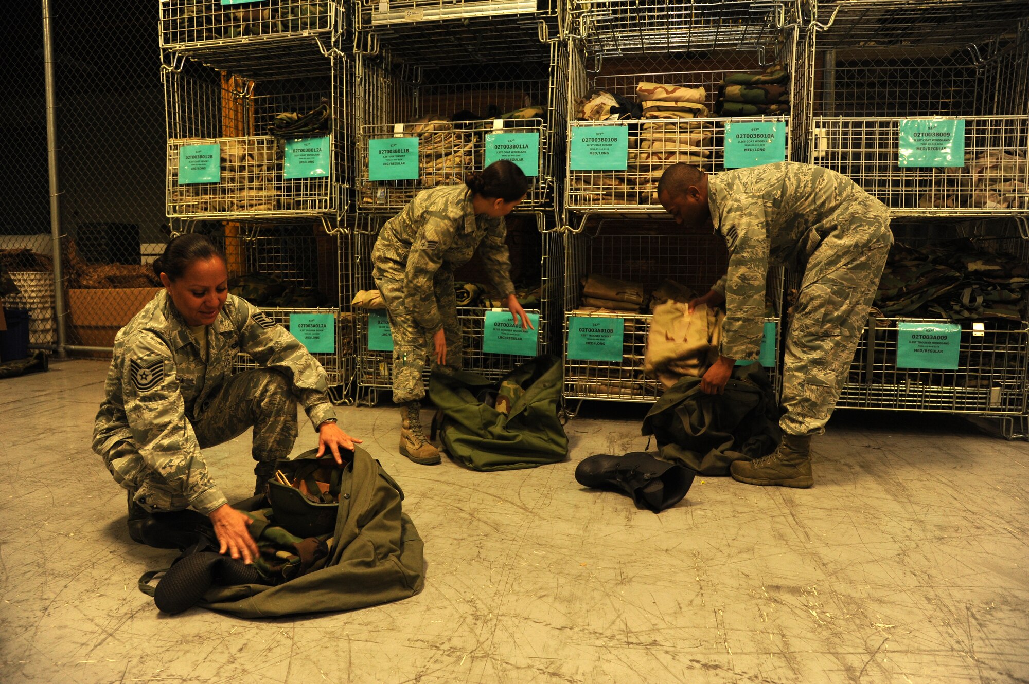 Airmen with the 927th Logistics Readiness Squadron prepare bags for deployment Feb. 8, 2015 at MacDill Air Force Base, Fla. Deployment bags carry mission related equipment. (U.S. Air Force photo/Senior Airman Xavier Lockley)