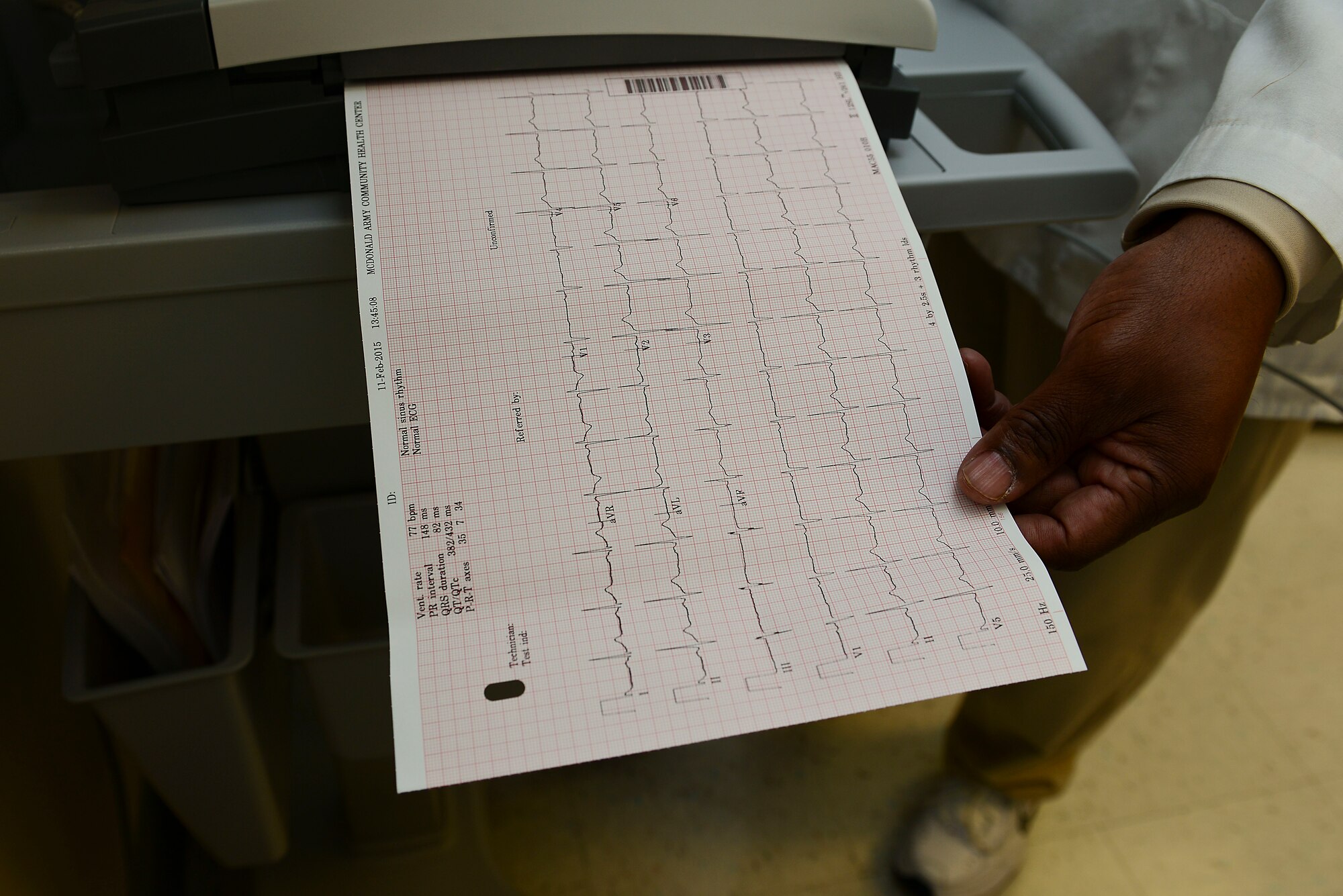 Glen Ford, U.S. Army Medical Department Activity medical instrument specialist, reads the results of an electrocardiogram at Fort Eustis, Va., Feb. 11, 2015. The EKG is a way to track ones heart health. February is Heart Health Month, which is used as a way to raise awareness about heart disease and how people can prevent it. (U.S. Air Force photo by Senior Airman Kimberly Nagle/Released) 