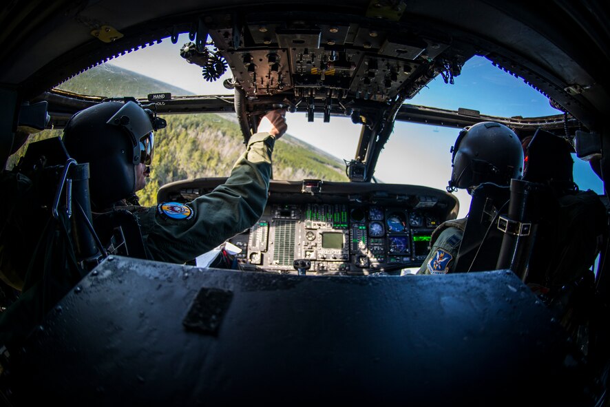 U.S. Air Force Maj. Joseph Andresky, left, and Capt. Margaret McCord, 41st Rescue Squadron HH-60G Pave Hawk pilots, fly over Grand Bay Bombing and Gunnery Range Feb. 19, 2015, at Moody Air Force Base, Ga.  HH-60G pilots primarily conduct personnel recovery operations including search and rescue, medical evacuation and humanitarian assistance missions. (U.S. Air Force photo by Senior Airman Ryan Callaghan/Released)
