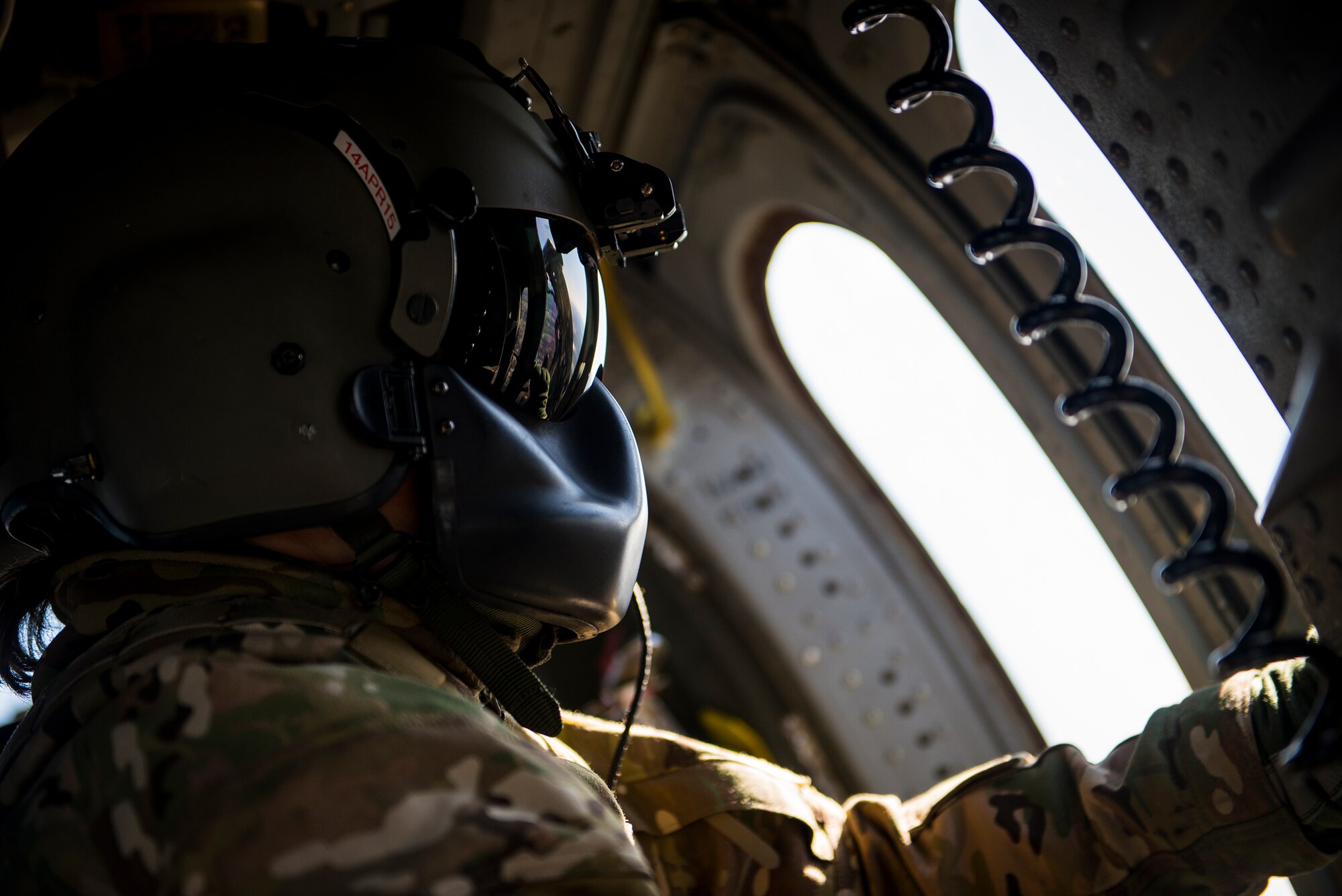 U.S. Air Force Tech. Sgt. Jewell Steamer, 41st Rescue Squadron special missions aviator, closes a gunner’s window in an HH-60G Pave Hawk Feb. 19, 2015, at Moody Air Force Base, Ga. Steamer is responsible for scanning for enemy threats and alerting the pilots to their location while in flight. (U.S. Air Force photo by Senior Airman Ryan Callaghan/Released)
