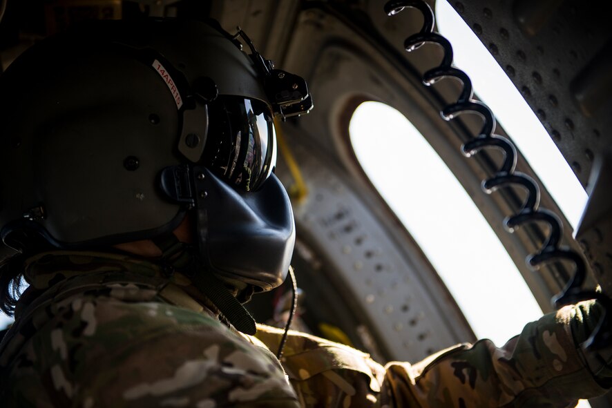 U.S. Air Force Tech. Sgt. Jewell Steamer, 41st Rescue Squadron special missions aviator, closes a gunner’s window in an HH-60G Pave Hawk Feb. 19, 2015, at Moody Air Force Base, Ga. Steamer is responsible for scanning for enemy threats and alerting the pilots to their location while in flight. (U.S. Air Force photo by Senior Airman Ryan Callaghan/Released)
