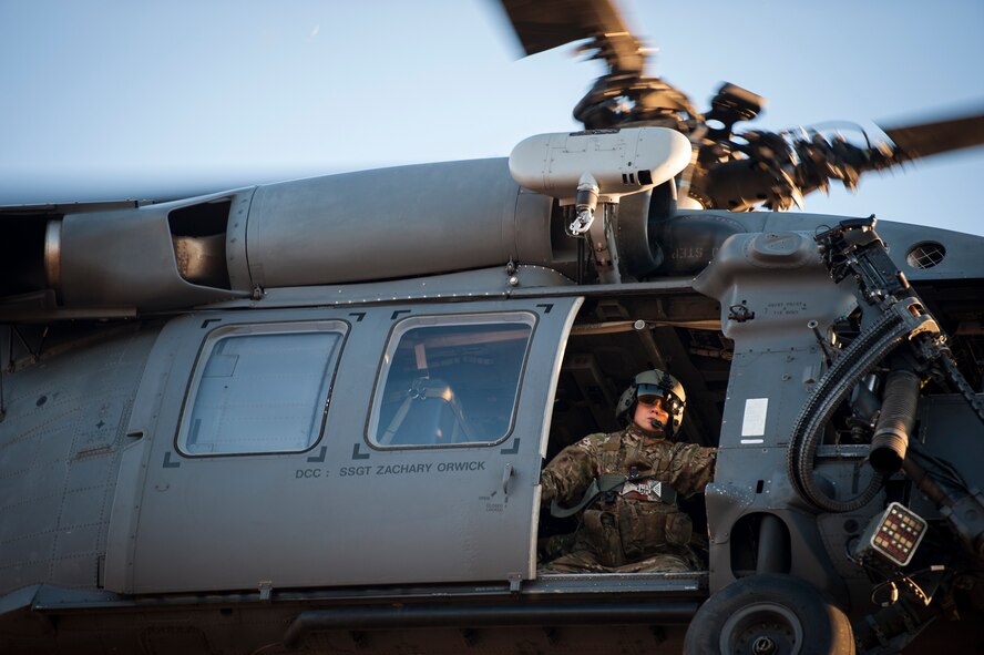 U.S. Air Force Tech. Sgt. Jewell Steamer, 41st Rescue Squadron special missions aviator (SMA), opens the door of an HH-60G Pave Hawk while hovering over Moody Air Force Base, Ga., Feb. 19, 2015. In addition to serving as aerial gunners, SMAs are also responsible for preflight and postflight aircraft inspections and ensuring the safety of passengers and equipment during flight. (U.S. Air Force photo by Senior Airman Ryan Callaghan/Released)
