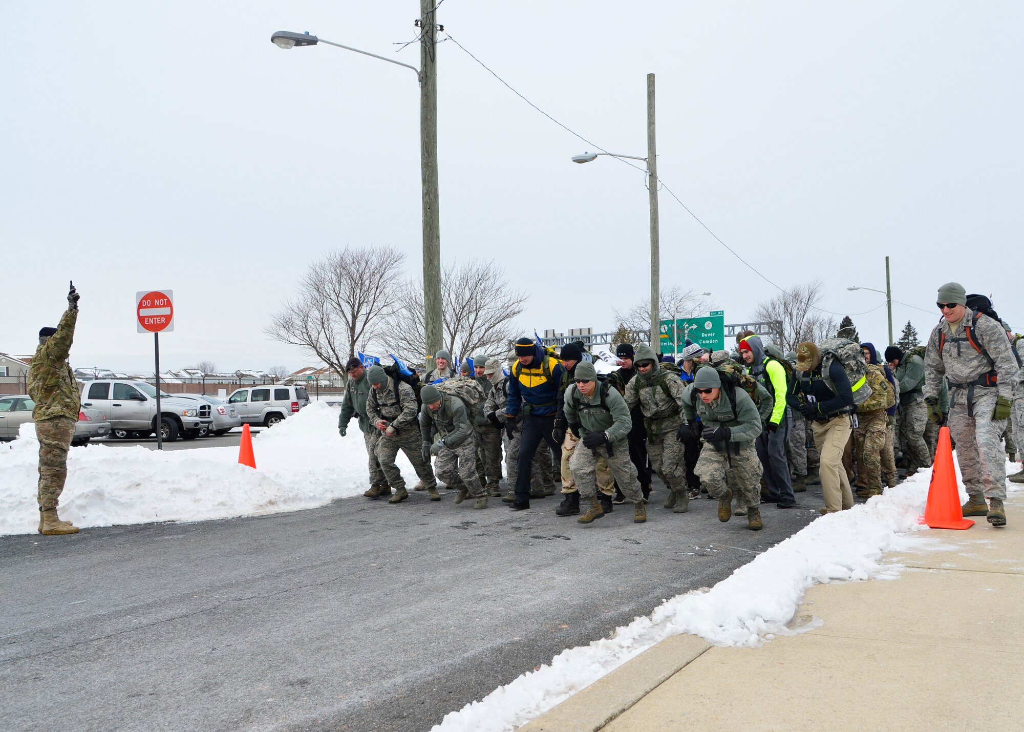 Runners sprint off the starting line of the 16th Annual Security Forces Ruck March Feb. 21, 2015, at Dover Air Force Base, Del. The ruck march consisted of 54 teams with 192 runners who ran the 6.2 mile course while wearing a 30-pound ruck sack. (U.S. Air Force photo/Airman 1st Class William Johnson)