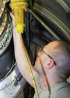 Tech. Sgt. James Johnson, an aircraft engine mechanic assigned to the 910th Propulsion Shop, installs thermal couples on a C-130 Hercules aircraft here, Feb. 7, 2015. He performed this task during an isochronal inspection. The isochronal inspection is completed as scheduled preventative maintenance on the 910th’s C-130 fleet. U.S. Air Force photo/by TSgt. Rick Lisum