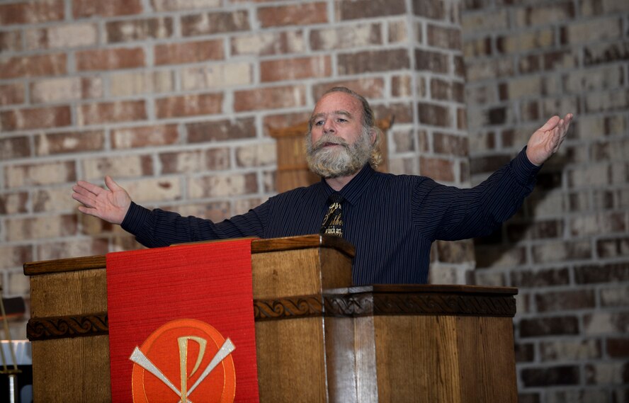 Stephen Watkins, Moody Air Force Base Chapel music director of Catholic Service, chants during Confirmation Mass Feb. 17, 2015, at Moody AFB, Ga. Three Team Moody members took part in the Sacrament of Confirmation, which Catholics believe more perfectly binds the confirmation candidate to the Church and enriches them with the Holy Spirit. (U.S. Air Force photo by Senior Airman Sandra Marrero/Released) 

