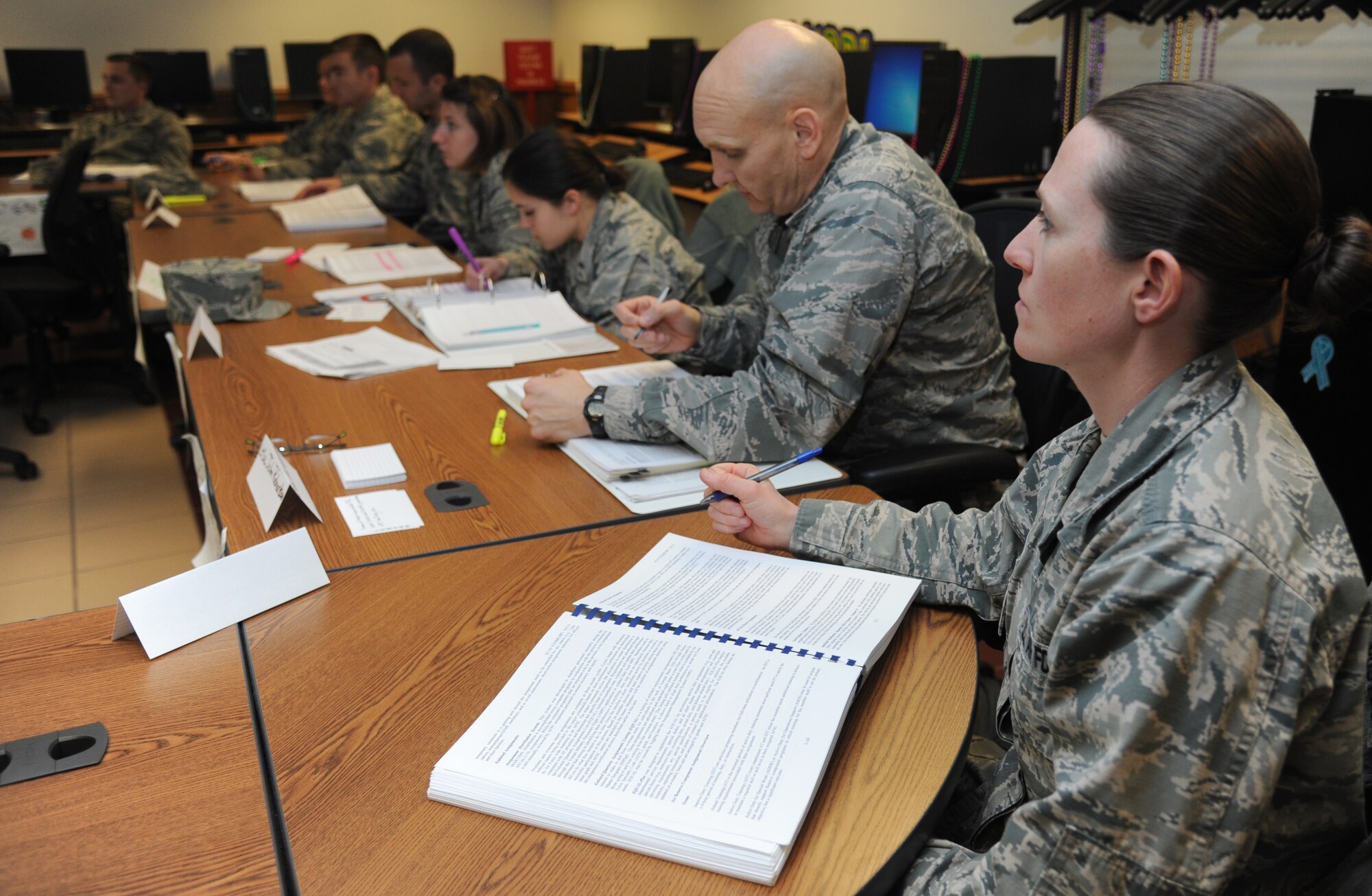 Second Lt. Carrie Doster, 335th Training Squadron student, listens to an instructor during the personnel officer course Feb. 19, 2015, at Wolfe Hall, Keesler Air Force Base, Miss.  (U.S. Air Force photo by Kemberly Groue)