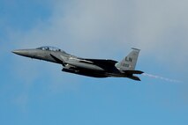 A 48th Fighter Wing F-15E Strike Eagle soars over the flightline at Royal Air Force Lakenheath, England, Feb. 24, 2015. The Liberty Wing’s forward presence and ready forces execute missions now in support of regional and global operations. (U.S. Air Force photo by Airman 1st Class Trevor T. McBride/Released)
