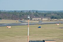 Two 48th Fighter Wing F-15E Strike Eagles taxi down the runway on the flightline at Royal Air Force Lakenheath, England, Feb. 24, 2015. The Liberty Wing’s forward presence and ready forces execute missions now in support of regional and global operations.  (U.S. Air Force photo by Airman 1st Class Trevor T. McBride/Released)