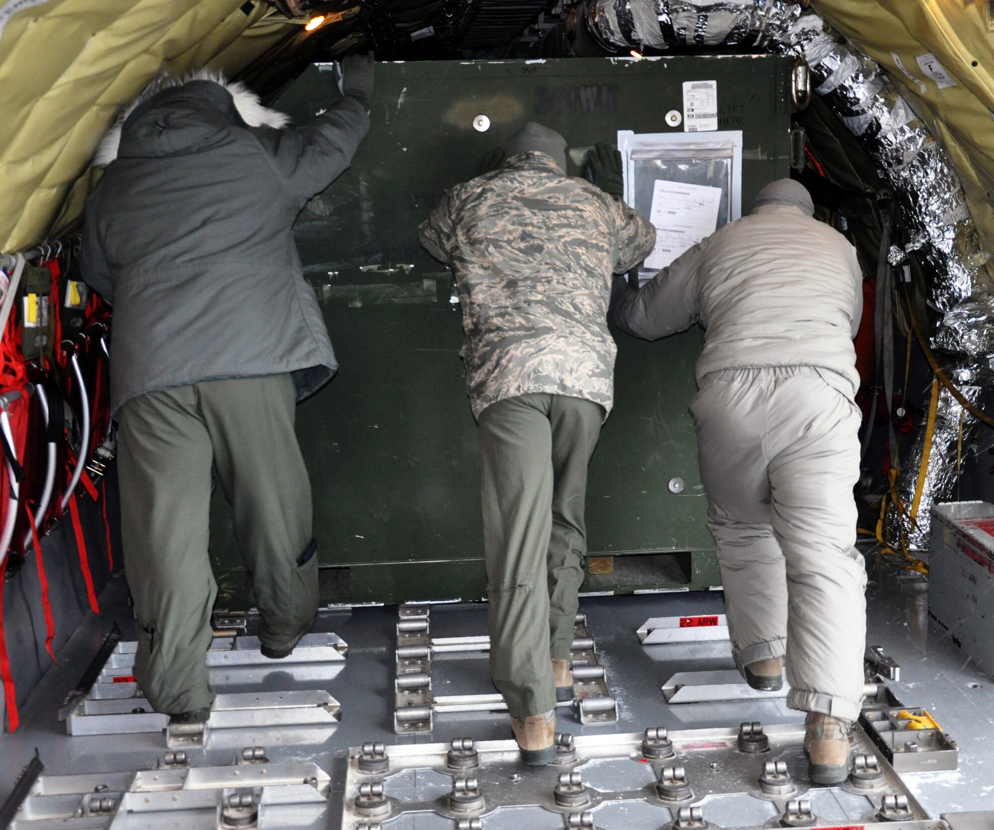 A Total Force team of A total force team of logistics personnel and air refueling boom operators from the active duty 22 ARW and Air Force Reserve 931st Air Refueling Group braved sub-freezing temperatures to load approximately 18,000 pounds of cargo onto the aircraft in preparation for Red Flag. Red Flag is a large-scale military training exercise conducted at Nellis Air Force Base, Nev. (U.S. Air Force photo by Capt. Zach Anderson) 