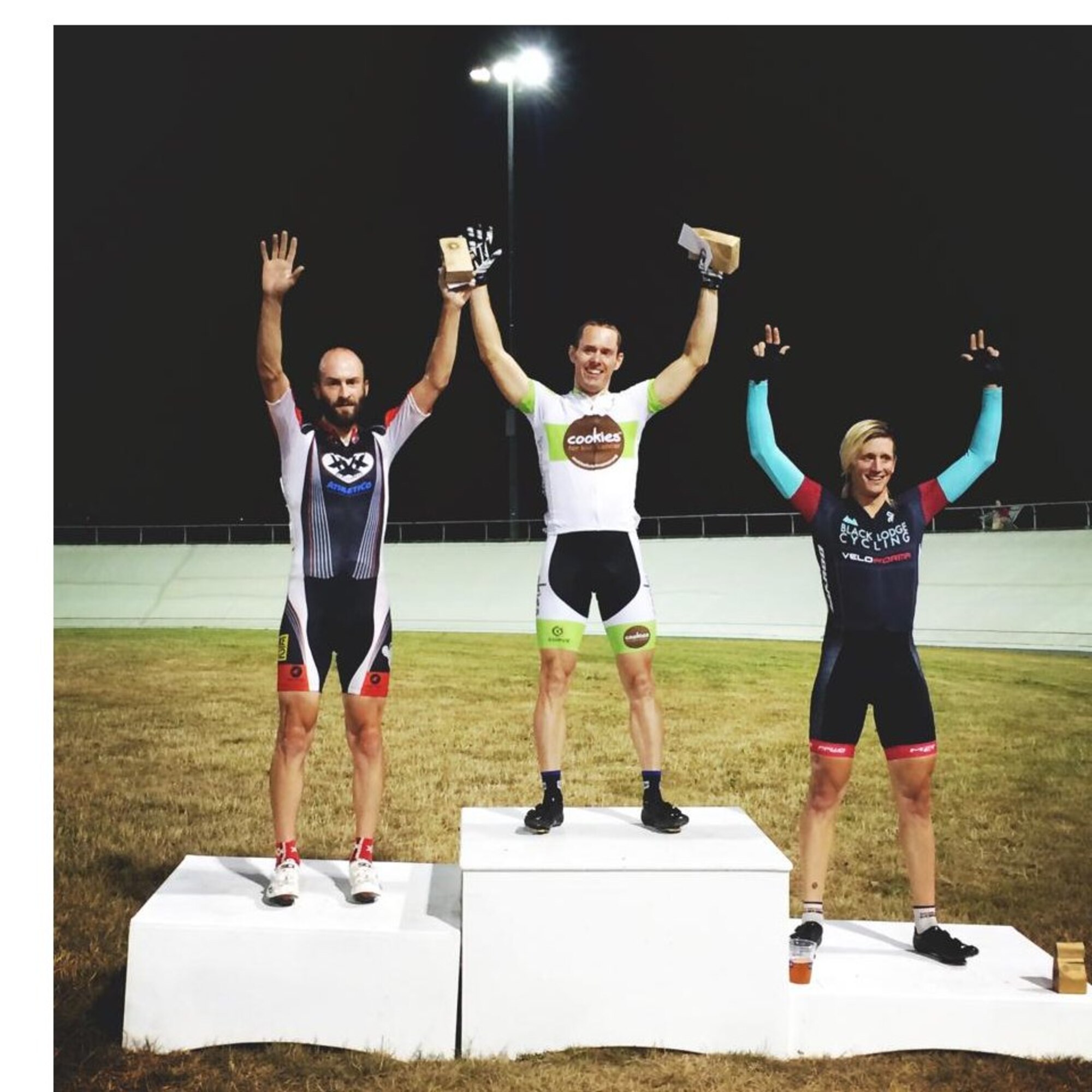 Taking the winner's podium, Maj. Ian Holt, Headquarters Air Force Space Command vault concepts lead, celebrates a victory at the Marymoor Grand Prix Scratch race, part of the National Track Calendar, in Redmond, Wash. Holt represents the Air Force in elite international cycling competitions around the globe. (Courtesy photo)