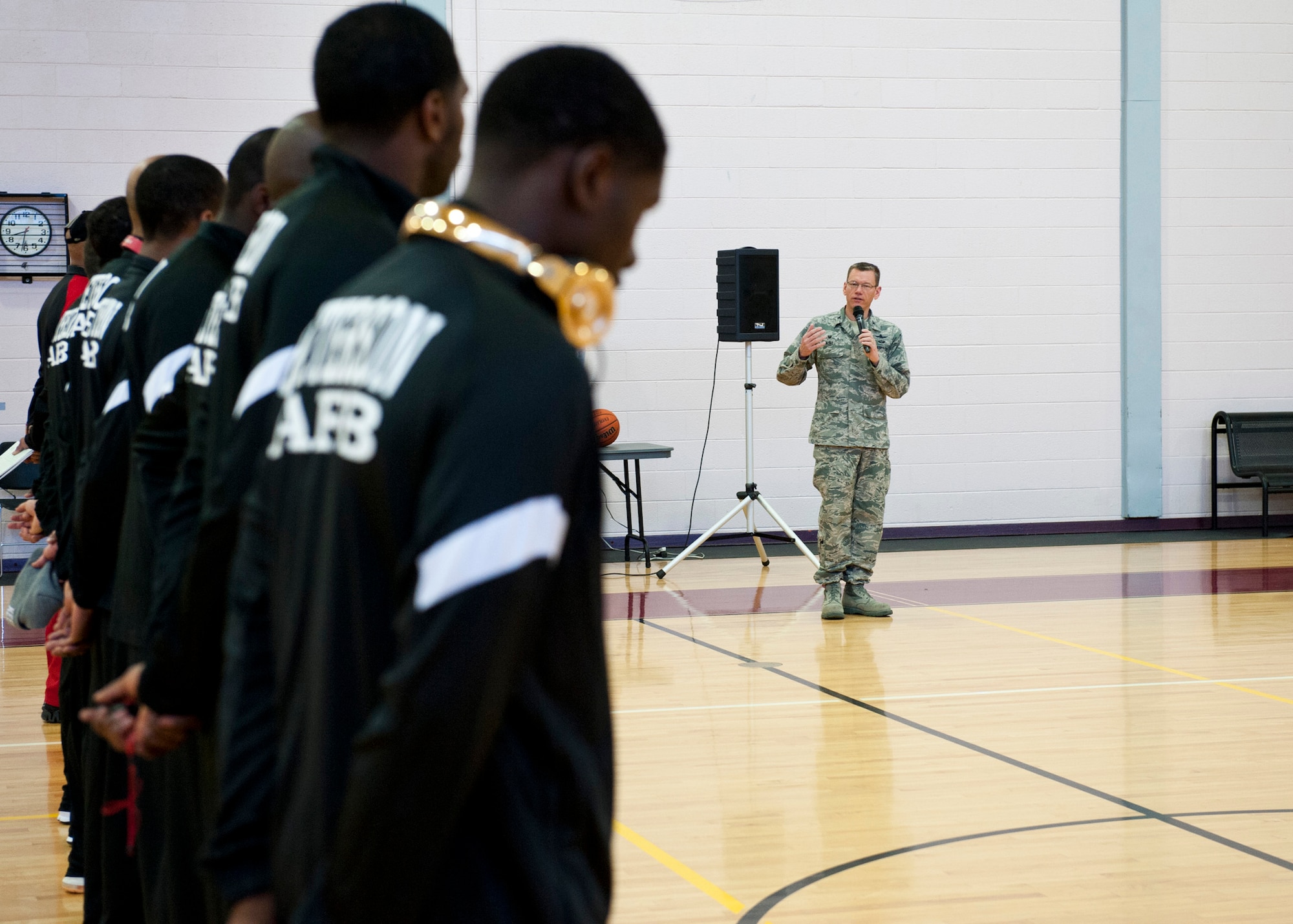 PETERSON AIR FORCE BASE, Colo. – Col. Reginald Ash III, 21st Space Wing Mission Support Group commander, speaks to the Peterson AFB and U.S. Air Force Academy teams before the first basketball game of the weekend tournament at the Peterson AFB gym, Feb. 14, 2015. Teams from F.E. Warren AFB, Fort Carson and Buckley AFB also participated in the tournament. Peterson AFB defeated F.E. Warren 81-67 in the championship game Feb. 15, 2015. (U.S. Air Force photo by Senior Airman Tiffany DeNault)