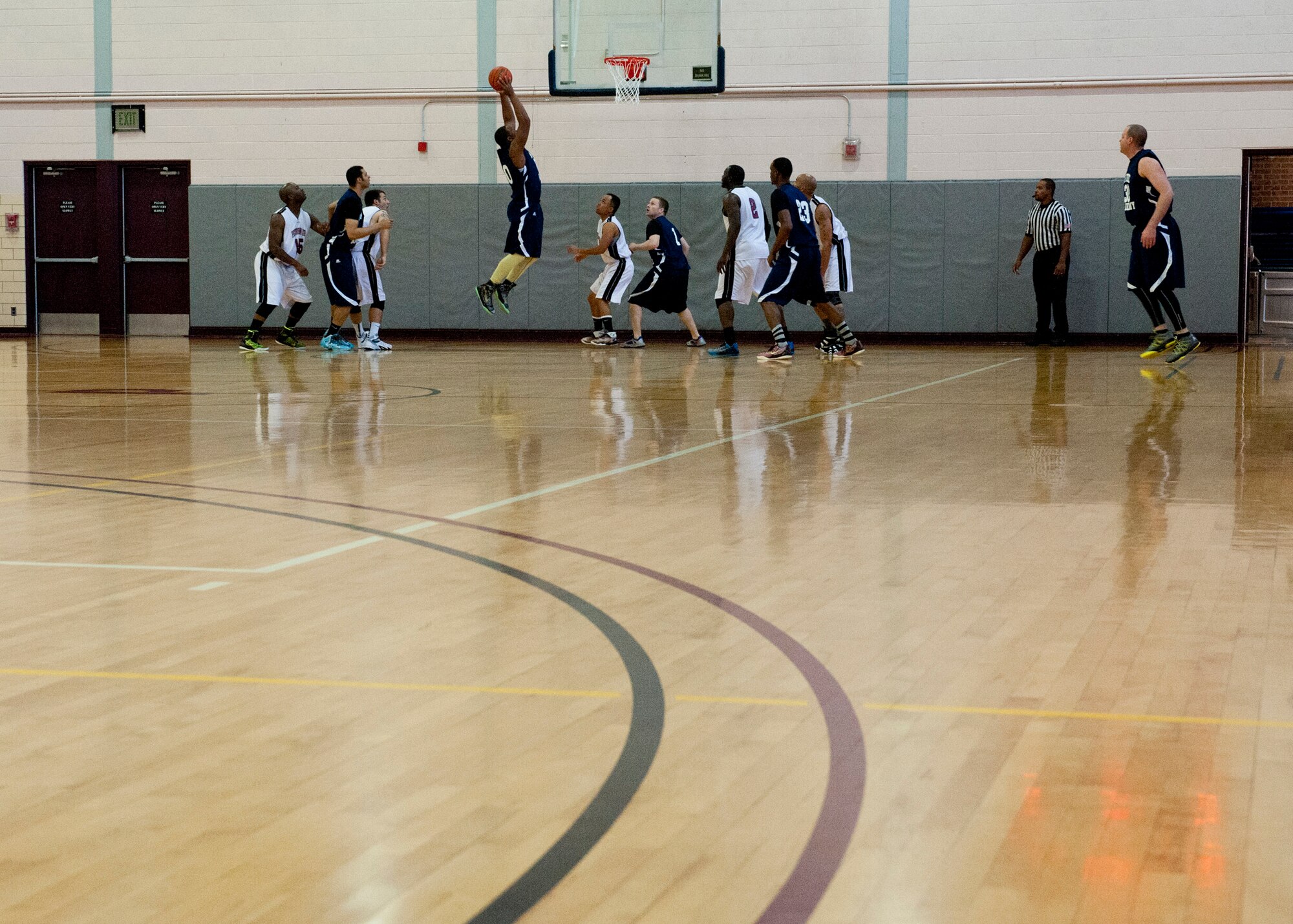PETERSON AIR FORCE BASE, Colo. – Members of Peterson AFB and U.S. Air Force Academy basketball teams participate in a tournament at the Peterson AFB gym, Feb. 14, 2015. Teams from F.E. Warren AFB, Fort Carson and Buckley AFB also participated in the tournament. Peterson AFB defeated F.E. Warren 81-67 in the championship game Feb. 15, 2015. (U.S. Air Force photo by Senior Airman Tiffany DeNault)