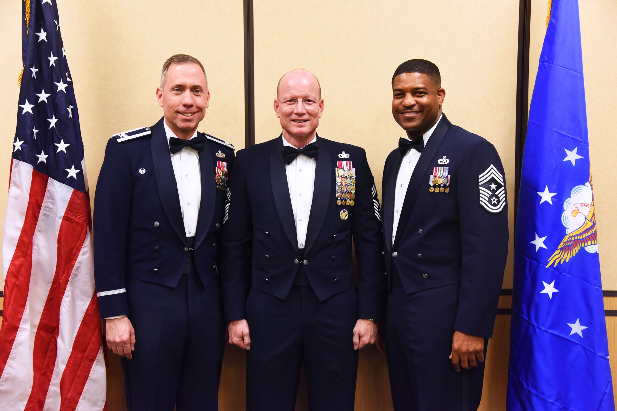From left to right, Col. John Wilcox, 341st Missile Wing commander; Chief Master Sgt. Terry West, Air Force Global Strike Command command chief; and Chief Master Sgt. Phillip Easton, 341st MW command chief, pose for a photograph at Malmstrom Air Force Base’s Grizzly Bend during the 2014 Annual Awards Banquet Feb. 20. West, who was on a two-day tour of the base, was the event’s guest speaker. (U.S. Air Force Photo/Airman 1st Class Collin Schmidt) 