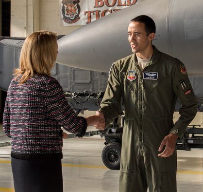 Secretary of the Air Force Deborah Lee James shakes hands with Capt. Theodore Ellis, 366th Operation Support Squadron wing munitions manager, during her visit to Mountain Home Air Force Base, Idaho, Feb. 18, 2015. Ellis and James discussed the 366th’s munitions program and some of the current challenges and successes. (U.S. Air Force photo by Airman 1st Class Jessica H. Smith/RELEASED)