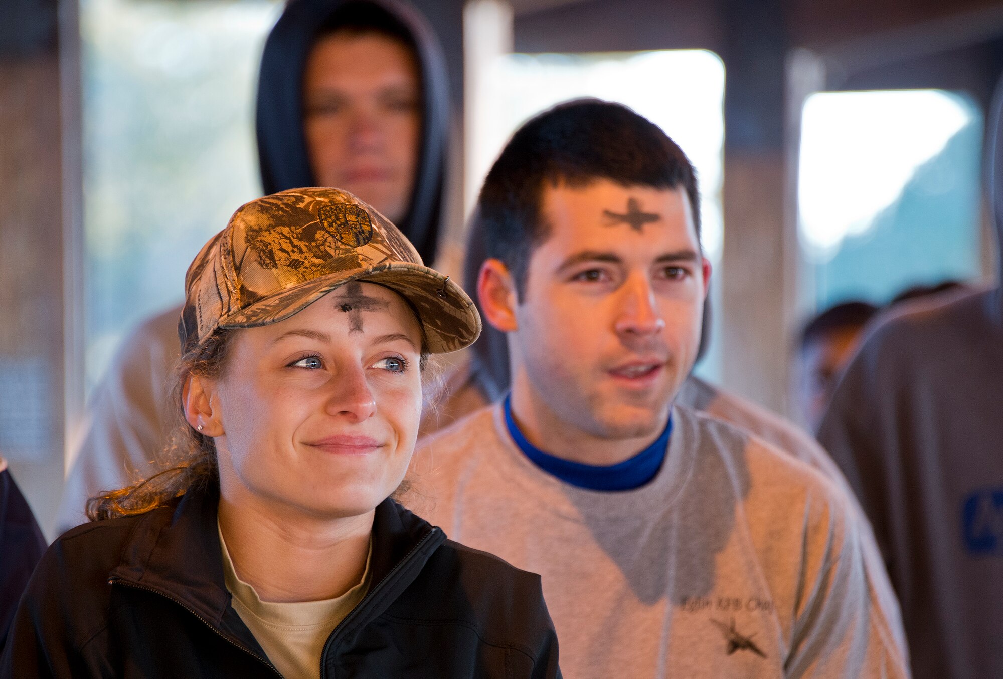 Participants of the Ashes to Dust 5K listen to devotional words by Chaplain Maj. James Hamel, Feb. 18 at the Civil Engineering Pavilion on Eglin Air Force Base, Fla.  Approximately 225 people attended the event on Ash Wednesday, a day that marks the beginning of the Lent season for Christians.  Eglin’s Chapel held the event to start the season with spiritual and physical inspiration and also the option to receive a cross of ashes for those who wanted to demonstrate their faith. (U.S. Air Force photo/Ilka Cole)