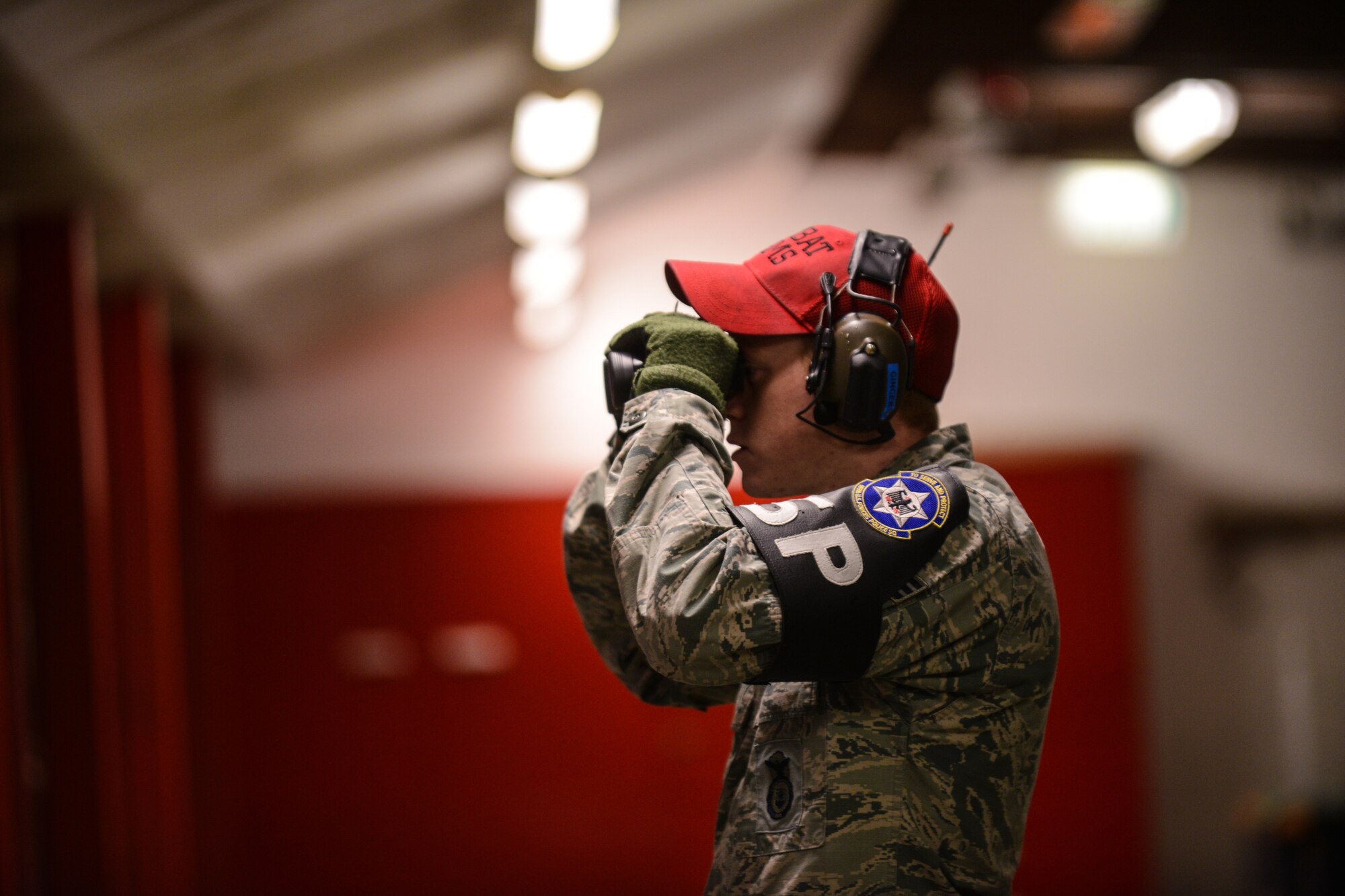 Senior Airman Shane Fairchild, 569th Combat Arms Training and Maintenance instructor reviews a target after an M-4 carbine qualification test at the Kaiserslautern Military Community Combat Arms Training and Maintenance Squadron, Vogelweh Military Complex, Germany, Feb. 23, 2015. CATM weapons courses equip Airmen with weapons skills such as proper safety, disassembly, firing and cleaning.  (U.S. Air Force photo/Senior Airman Nicole Sikorski)
