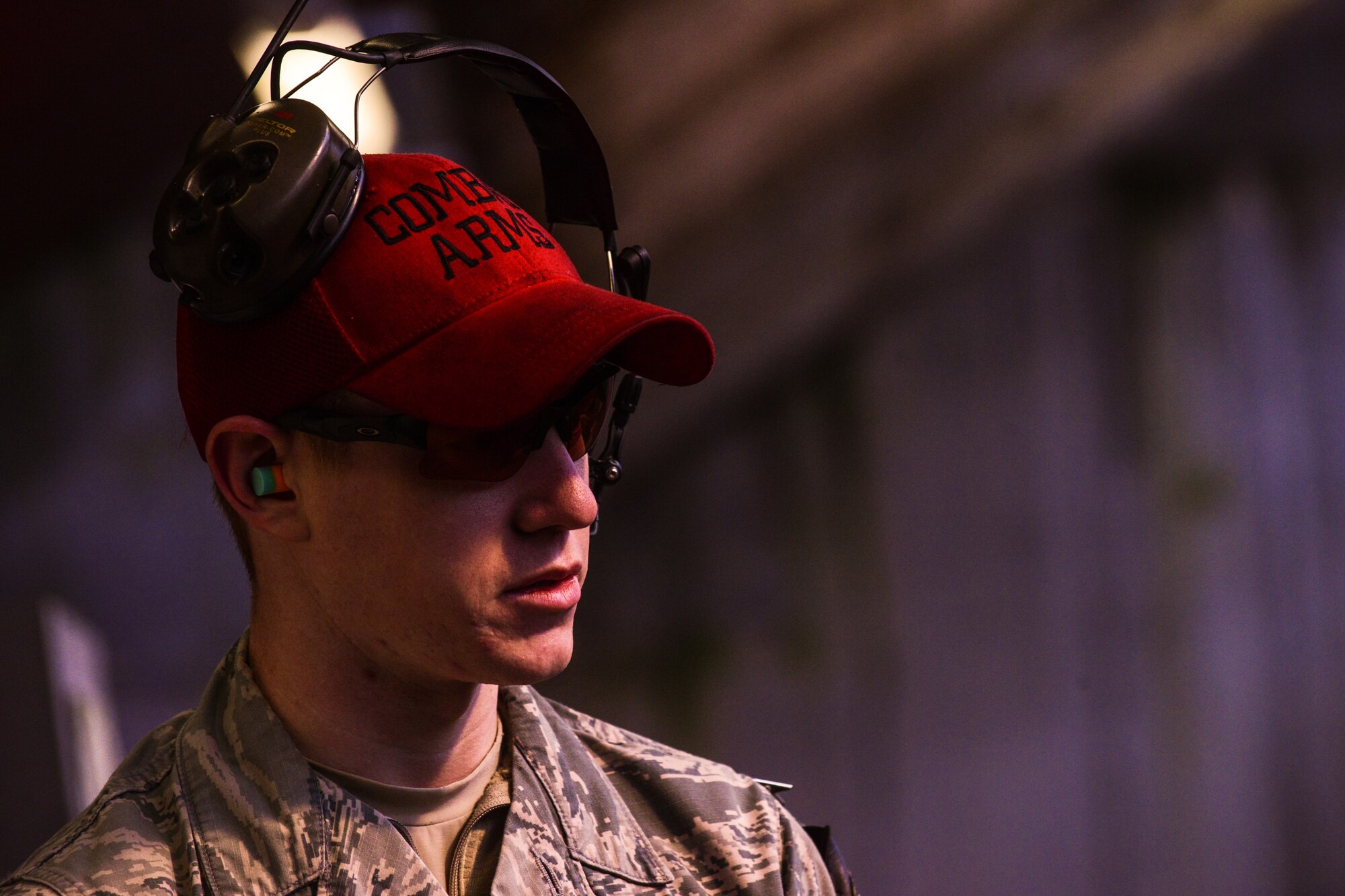 Senior Airman Shane Fairchild, 569th Combat Arms Training and Maintenance instructor, observes Airmen during their M-4 carbine qualification test at the Kaiserslautern Military Community Combat Arms Training and Maintenance Squadron, Vogelweh Military Complex, Germany, Feb. 23, 2015. The KMC CATM has the highest tempo for weapons qualifications within U.S. Air Forces Europe. (U.S. Air Force photo/Senior Airman Nicole Sikorski)