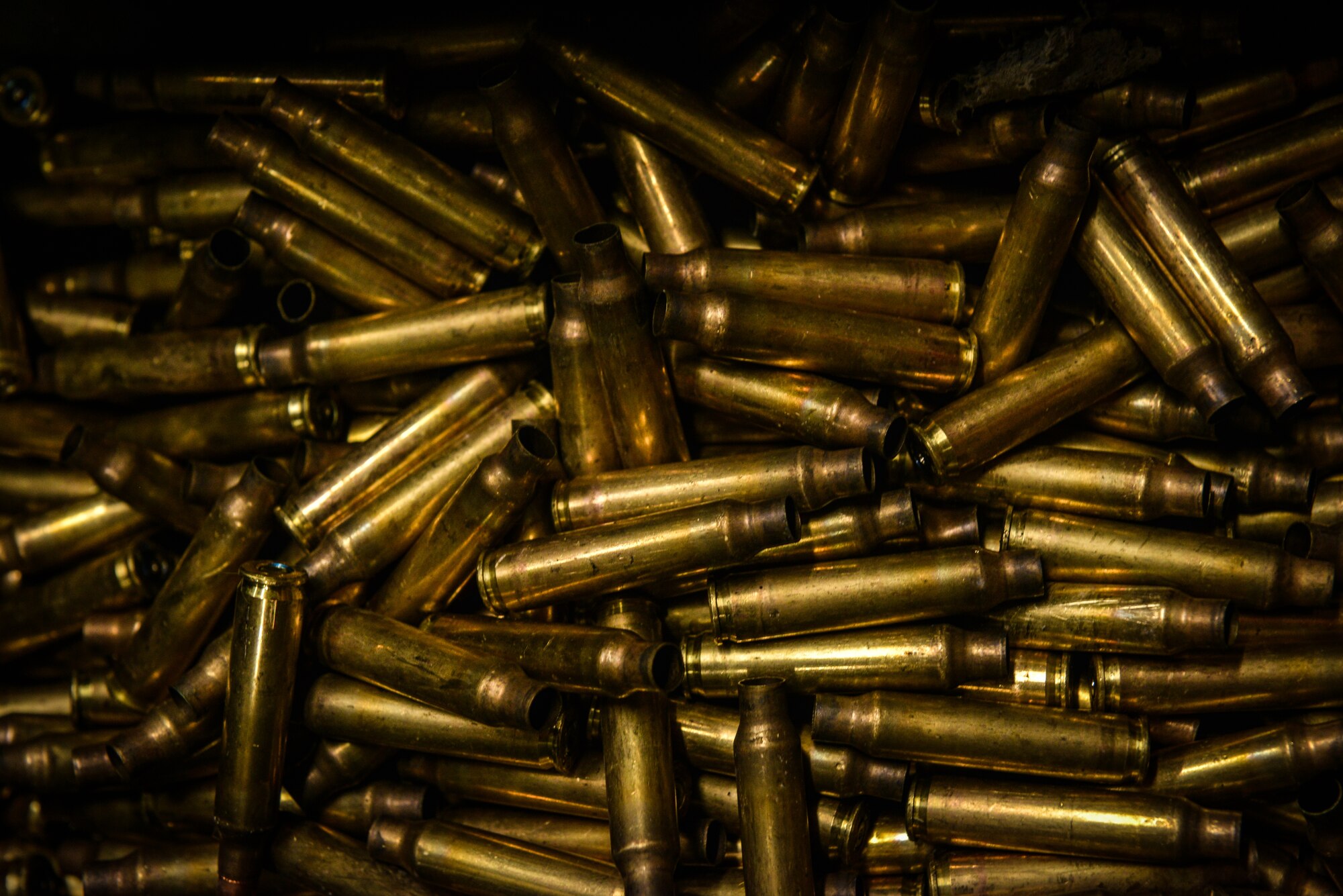 Bullet shells fill a bin at the 569th Combat Arms Training and Maintenance firing range, Vogelweh Military Complex, Germany, Feb. 19, 2015. The Kaiserslautern Military Community CATM is responsible for all firing qualifications in the KMC area and eight geographical separated units. (U.S. Air Force photo/Senior Airman Nicole Sikorski)
