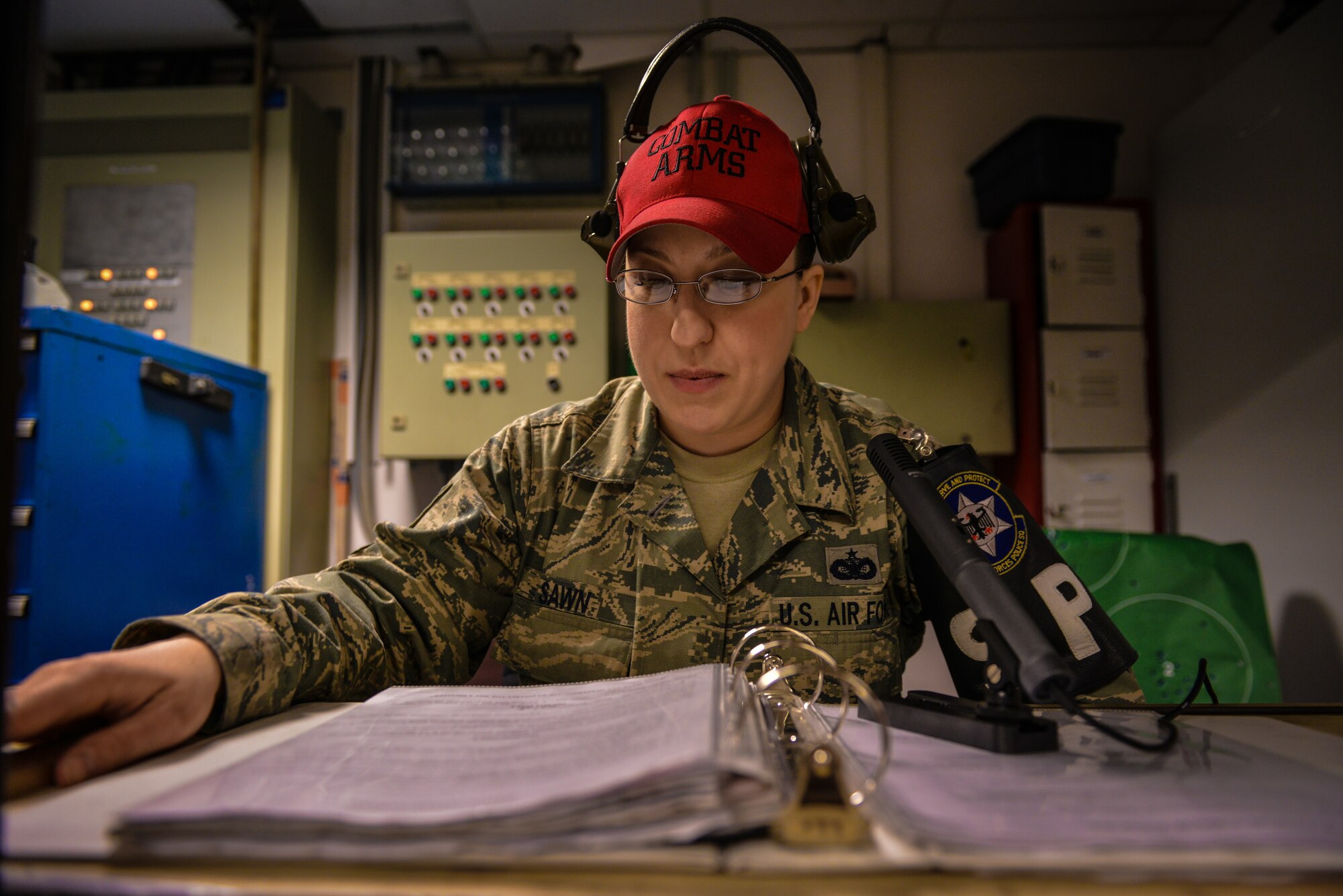 Staff Sgt. Kellie Sawn, 569th Combat Arms Training and Maintenance instructor, briefs students on weapons safety at Vogelweh Military Complex, Germany, Feb. 19, 2015.  CATM instructors at Vogelweh qualify more than 7,000 students annually. (U.S. Air Force photo/Senior Airman Nicole Sikorski) 