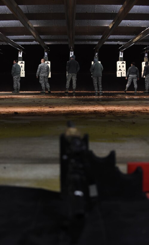 Security forces members check their results after a round of shooting the M4 Carbine at the firing range on Joint Base Andrews, Md., Feb. 3, 2015. (U.S. Air Force photo/Airman 1st Class Philip Bryant)