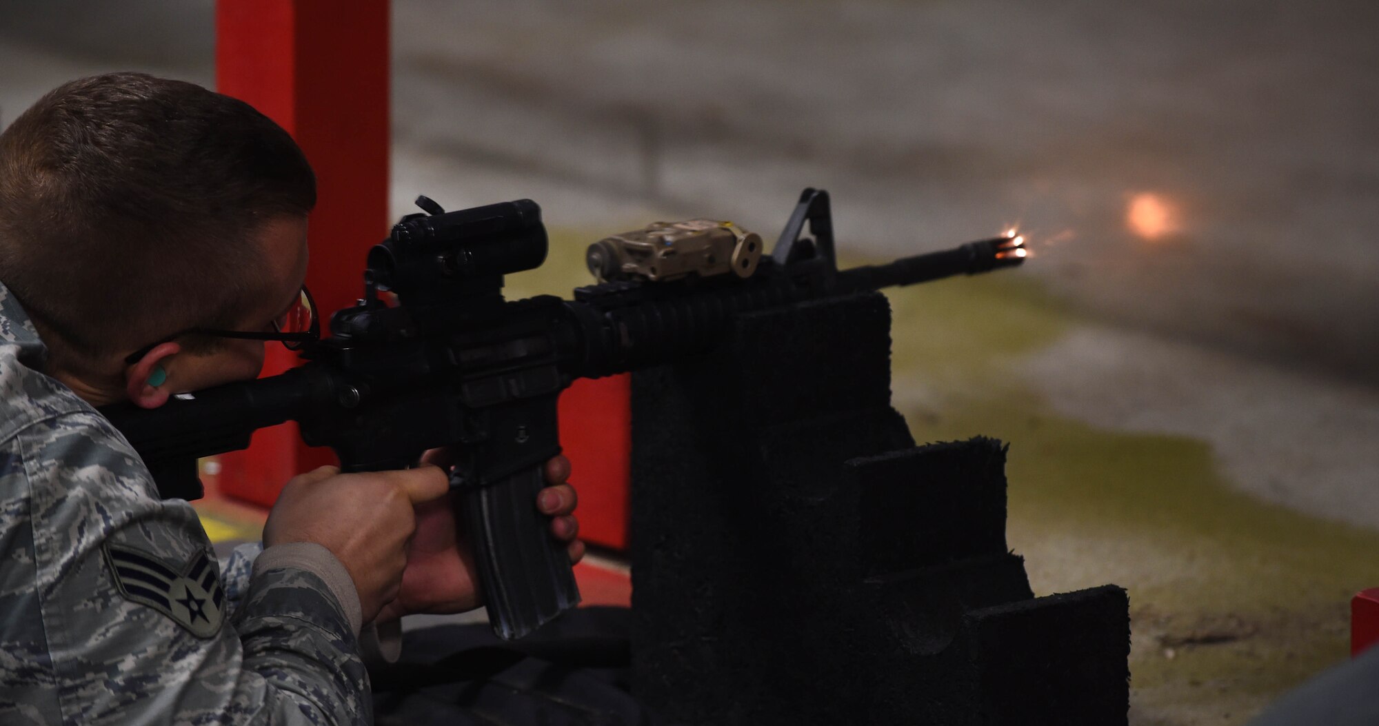 Senior Airman Benjamin Thomas, 811th Security Forces Group response force leader, fires an M4 Carbine during an Air Force qualification course at the firing range on Joint Base Andrews, Md., Feb. 3, 2015. Fourteen security forces members from JBA shot in the course to remain qualified for duty. (U.S. Air Force photo/Airman 1st Class Philip Bryant)