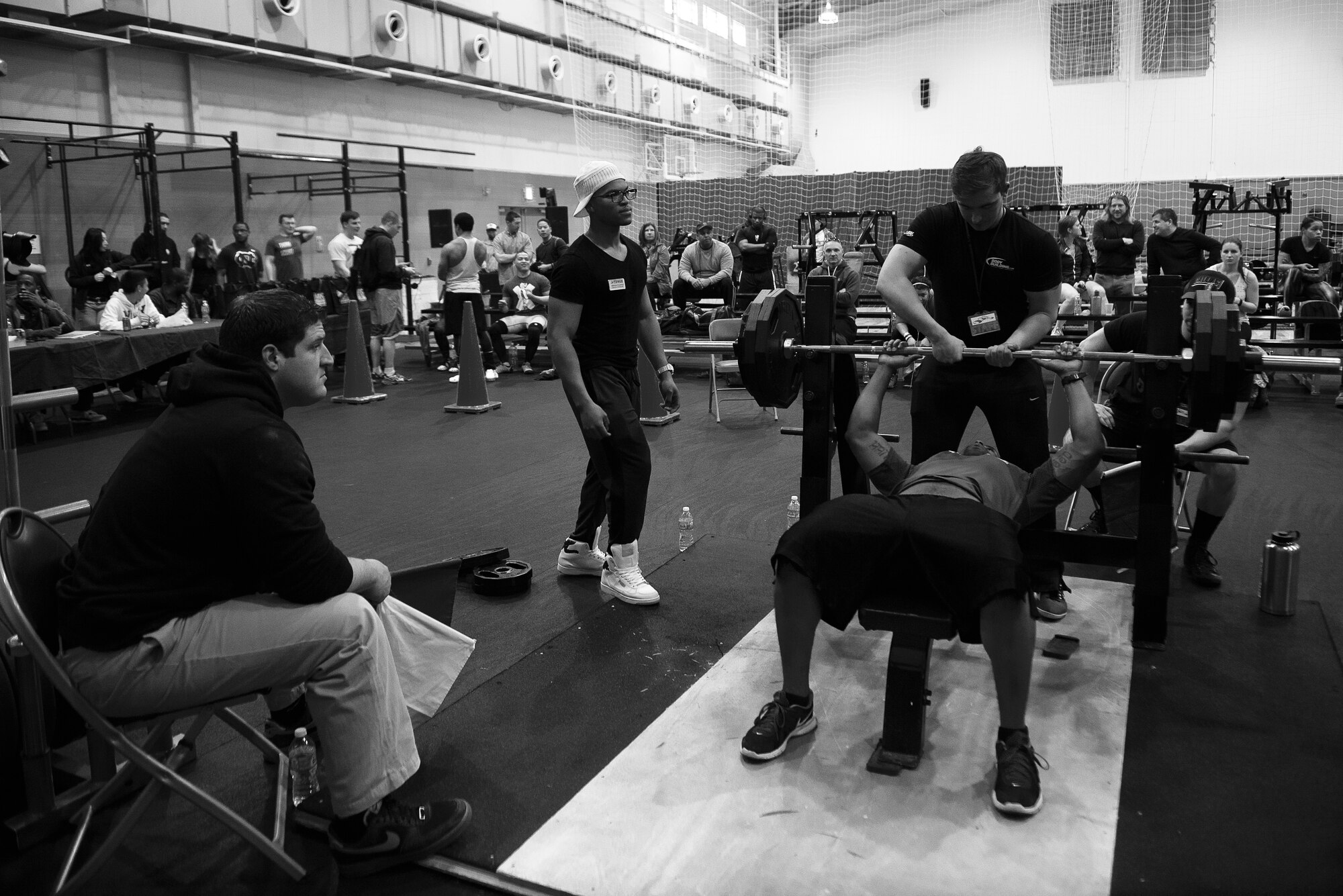 U.S. Air Force Staff Sgt. Ricky Petion, event competitor, prepares to perform a bench press repetition in the 2015 Yokota Powerlifting Invitational held in the Samurai Fitness Center at Yokota Air Base, Japan, Feb. 21, 2015. The bench press was one of three exercises that Petion performed in the competition. (U.S. Air Force photo by Airman 1st Class Delano Scott/Released)