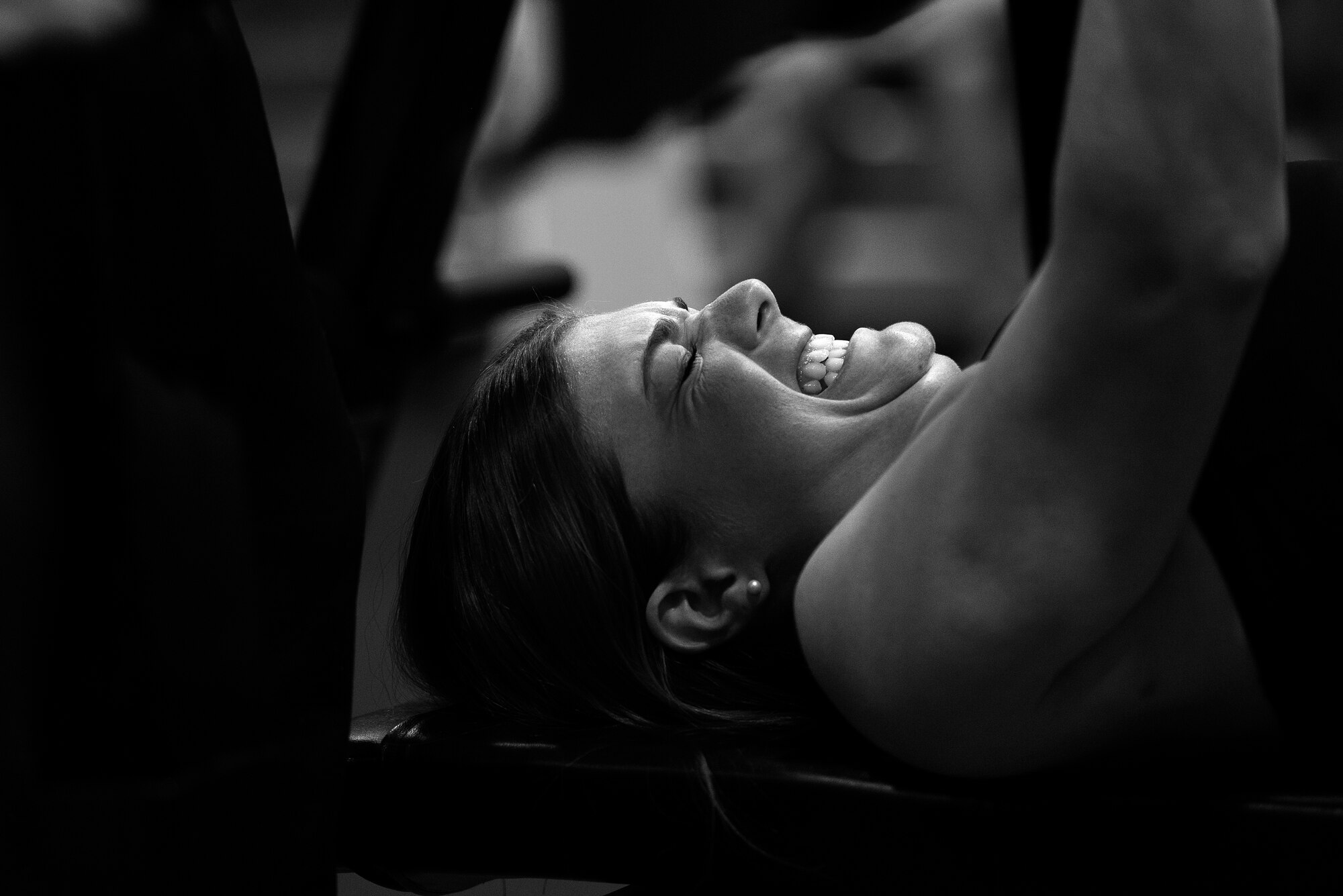 An event competitor performs a bench press rep in the 2015 Yokota Powerlifting Invitational held in the Samurai Fitness Center at Yokota Air Base, Japan, Feb. 21, 2015. Yokota plans to host competitive powerlifting competitions annually. (U.S. Air Force photo by Airman 1st Class Delano Scott/Released)