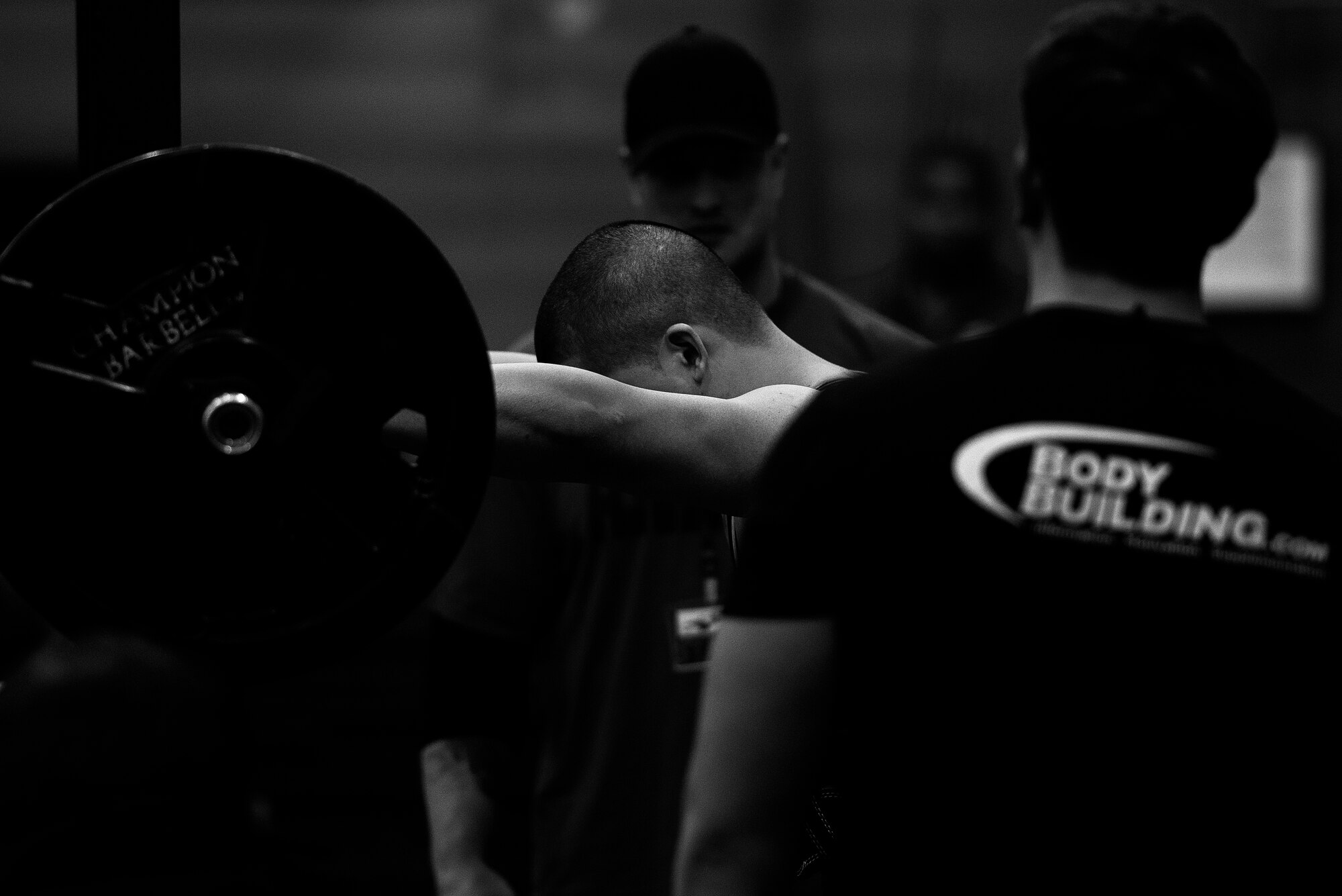 U.S. Air Force Staff Sgt. David Miguel, event competitor, prepares to perform a squat in the 2015 Yokota Powerlifting Invitational held in the Samurai Fitness Center at Yokota Air Base, Japan, Feb. 21, 2015. Miguel was one of 20 competitors to test their strength in the invitational. (U.S. Air Force photo by Airman 1st Class Delano Scott/Released)