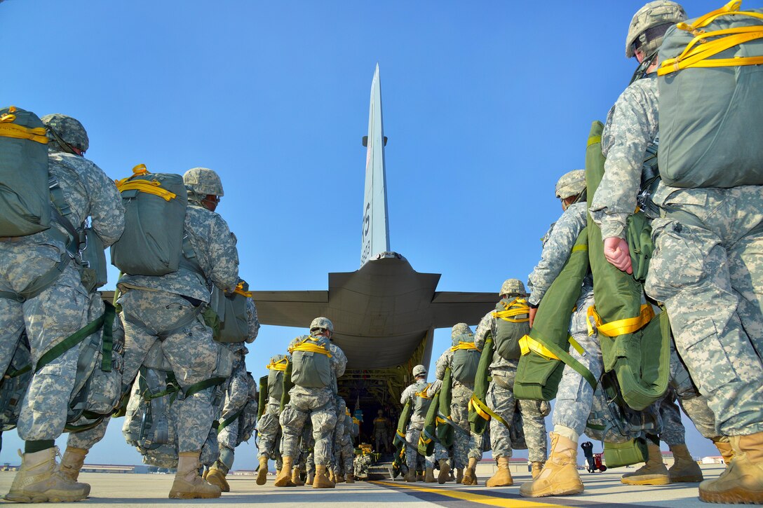 U.S. Army paratroopers load up into a U.S. Air Force C-130 Hercules aircraft on Aviano Air Base, Italy, before conducting an airborne operation on Juliet drop zone in Pordenone, Italy, Feb. 19, 2015. The hercules crew is assigned to the 86th Airlift Wing from Ramstein Air Base, Germany.