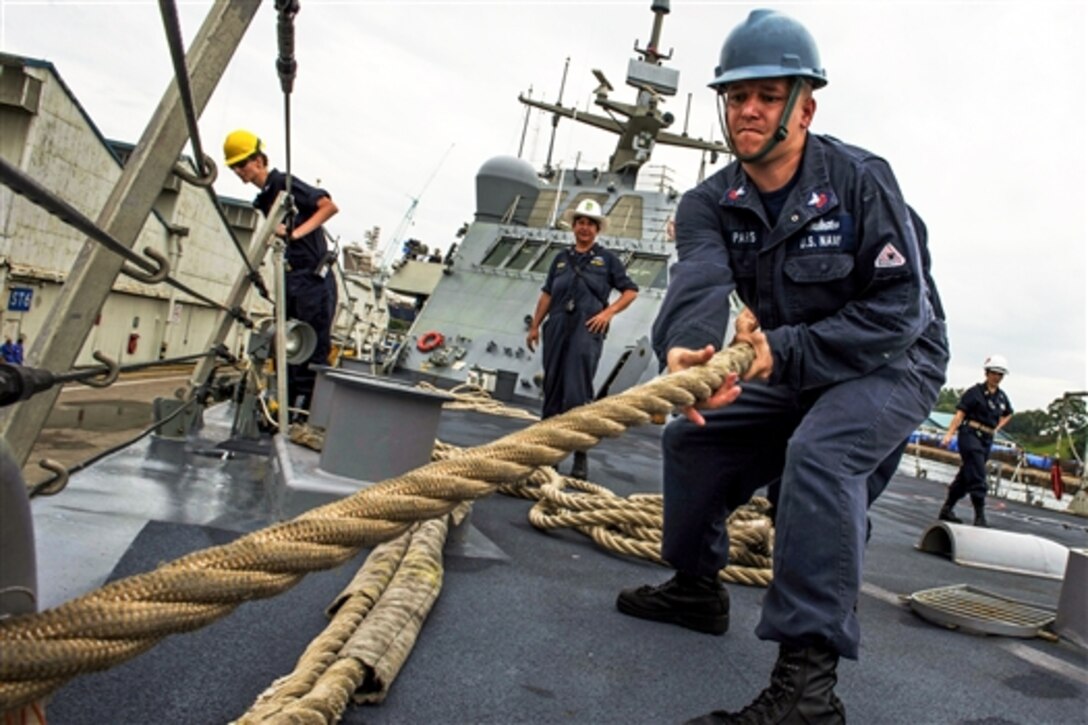 U.S. Navy Petty Officer 1st Class Robert Parks heaves a mooring line on the forecastle of the littoral combat ship USS Fort Worth during a detail in Sembawang, Singapore, Feb. 19, 2015. The combat ship is on a 16-month deployment to support the Asia-Pacific rebalance. 
 