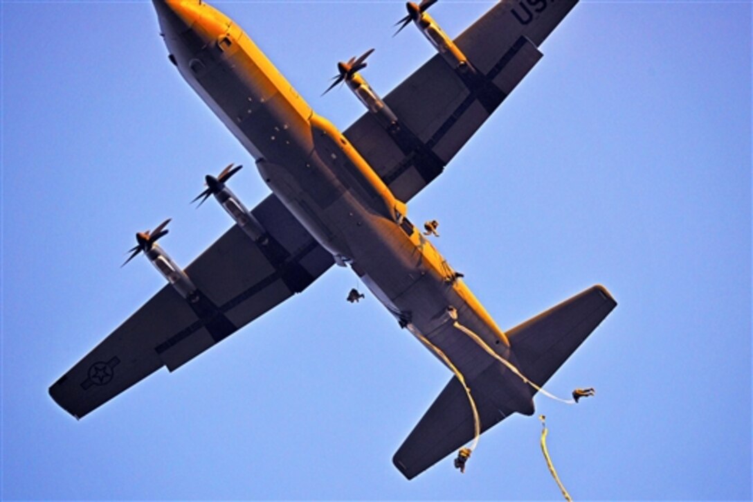 U.S. soldiers jump from an Air Force C-130 Hercules aircraft above Juliet Drop Zone in Pordenone, Italy, Feb. 19, 2015, during airborne operations training. The paratroopers, assigned to the 173rd Brigade Support Battalion, 173rd Airborne Brigade, are the Army’s Europe-based, contingency-response force. 
 