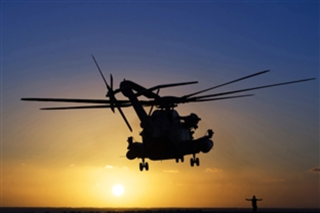 A CH-53 Sea Stallion helicopter takes off from the flight deck of amphibious assault ship USS America in the Pacific Ocean, Feb. 23, 2015. The America is conducting maritime operations off the coast of California.