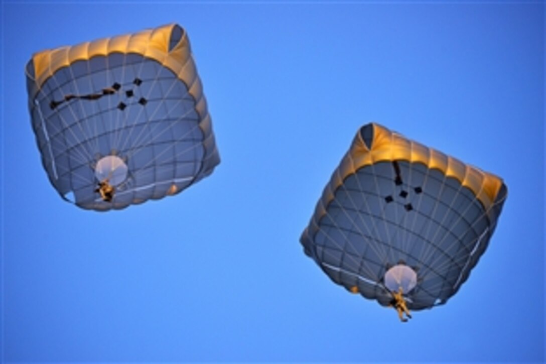 U.S. soldiers descend to Juliet Drop Zone in Pordenone, Italy, Feb. 19, 2015, during airborne operations training. The paratroopers are assigned to the 173rd Brigade Support Battalion, 173rd Airborne Brigade, and are the Army’s Europe-based, contingency-response force.