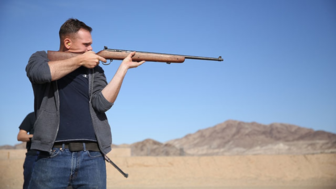 Cpl. James Marker, Marksmanship Training Unit Shooting Team, native of Wild Rose Wis., shoots a Harrington and Richardson .22 caliber rifle during the 3rd annual Smallbore and Air Rife Competition at Range 3 A, Feb. 21, 2015. Each participant had to load one round at a time and fire on five targets in a time limit of two and half minutes.