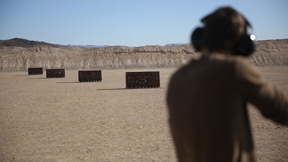 Logan Hardy, son of Master Sgt. Jeff Hardy, shoots a Henry Lever Action .22 caliber rifle during the 3rd annual Smallbore and Air Rifle Competition at Range 3 A, Feb. 21, 2015. The participants shot at silhouettes of chickens, pigs, turkeys and rams.