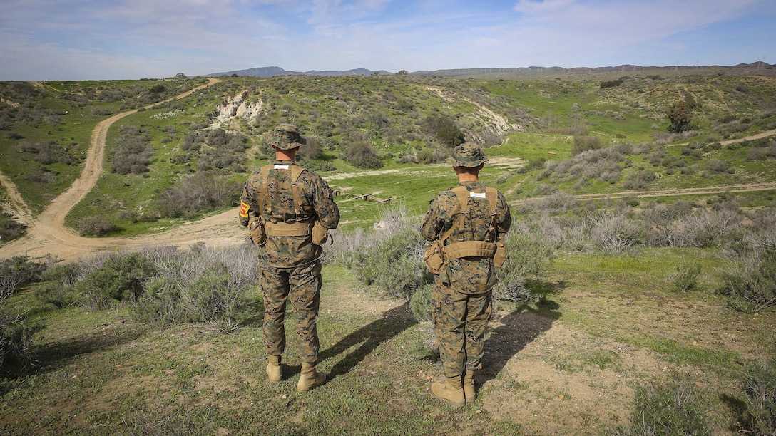 Recruits Jacob R. Kottman and Chainey L. Ellis, (left to right) Platoon 2105, Echo Company, 2nd Recruit Training Battalion, determine the direction to their mark during the Land Navigation Course at Edson Range, Marine Corps Base Camp Pendleton, Calif., Jan. 22. Going through the course with minimal, or at times no supervision, recruits had a chance to get a sense of the critical factor of learning and properly executing the techniques they were taught.