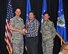 Col. Sean McElhaney Pahia, Air Reserve Personnel Center vice commander, and Chief Master Sgt. Ruthe Flores, ARPC command chief, present the Category II, Supervisory Civilian of the Year award to Kenneth Kluza. McElhaney Pahia honored ARPC’s 2014 outstanding performers of the year as well as their A1 annual award winners at the Summit Conference and Event Center Feb. 24, 2015, in Denver. (U.S. Air Force photo/Tech. Sgt. Rob Hazelett)