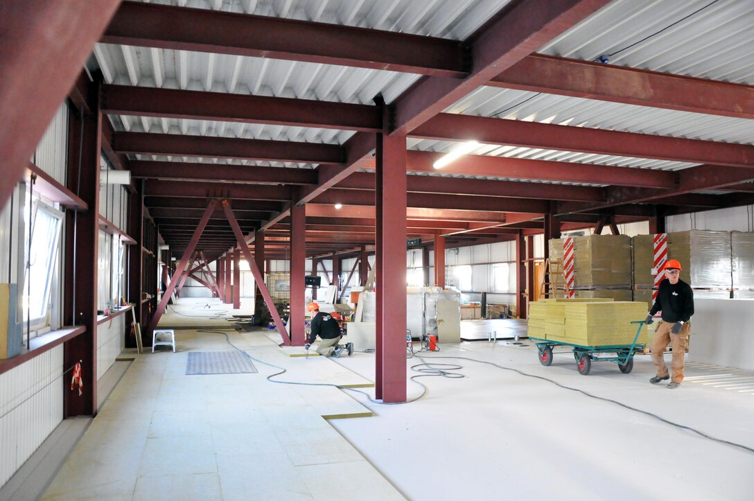 Contractors working inside one of the dorms