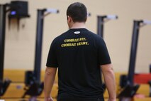 A High Intensity Tactical Training instructor and course coordinator, wears a HITT-themed shirt to motivate Marines during the HITT instructor certification course at the Hopkins Hall Gym at Camp Allen in Norfolk, Virginia. Feb. 10. A very important role of HITT is to train Marines to prepare them physically for combat.