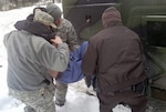 Soldiers with the Virginia Army National Guard assist a Wise County Sheriff’s Office deputy with transporting a Norton, Virginia, resident in need of medical treatment Feb. 23. Soldiers from the Virginia Army Guard have been on duty since Feb. 16 assisting local authorities as they respond to winter storms that dropped snow and ice throughout the region