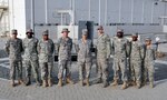 A nine-person team from the New Jersey Air National Guard's 108th Force Support Squadron, 108th Air Refueling Wing, at Joint Base McGuire-Dix-Lakehurst, N.J., are deployed supporting operations Iraqi Freedom, Enduring Freedom and the Combined Joint Task Force-Horn of Africa for the 380th Air Expeditionary Wing in Southwest Asia. The team includes, from left, Senior Airman Abdul Montaser, Airman 1st Class Andre Jackson, Staff Sgt. Heather Bartlett, Tech. Sgt. Jeremy Berry, Tech. Sgt. Lauren Holba, Tech. Sgt. Taylor Holba, Senior Airman Darnell Holmes, Senior Airman Levar Kinard, and Airman 1st Class Patricia Arias.