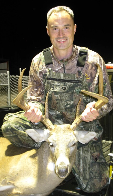 Maj. John Skutch, director, Future Plans Division, Marine Corps Logistics Command, shows off the heaviest buck harvested during Marine Corps Logistics Base Albany’s 2014-2015 bow hunting season. Skutch harvested his buck, Oct. 22, 2014, weighing in at 198 pounds.