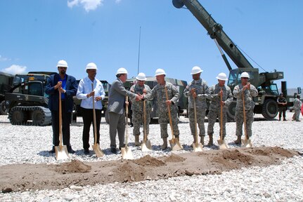 From left to right: Mr. Pierre Michele Laguerre, the director general of the Haiti Ministry of Education, Dr. Gabriel Timonthe, the director general of the Haiti Ministry of Public Health, Mr. David Lindwall, the deputy chief of mission, Army Maj. Gen. Bennett C. Landreneau, the adjutant general of Louisiana National Guard, Army Col. Michael J. Borrel, commander of Task Force Kout Men, Army Brig. Gen. Renaldo Rivera, the adjutant general of the Virgin Islands, Army Brig. Gen. Manuel Ortiz Jr., the deputy commanding general of the U.S. Army South, and Command Sgt. Maj. Tommy Callier, the senior enlisted advisor of the Louisiana National Guard, celebrate after the Task force Kout Men New Horizons 2010 opening ceremony June 15, 2010.
