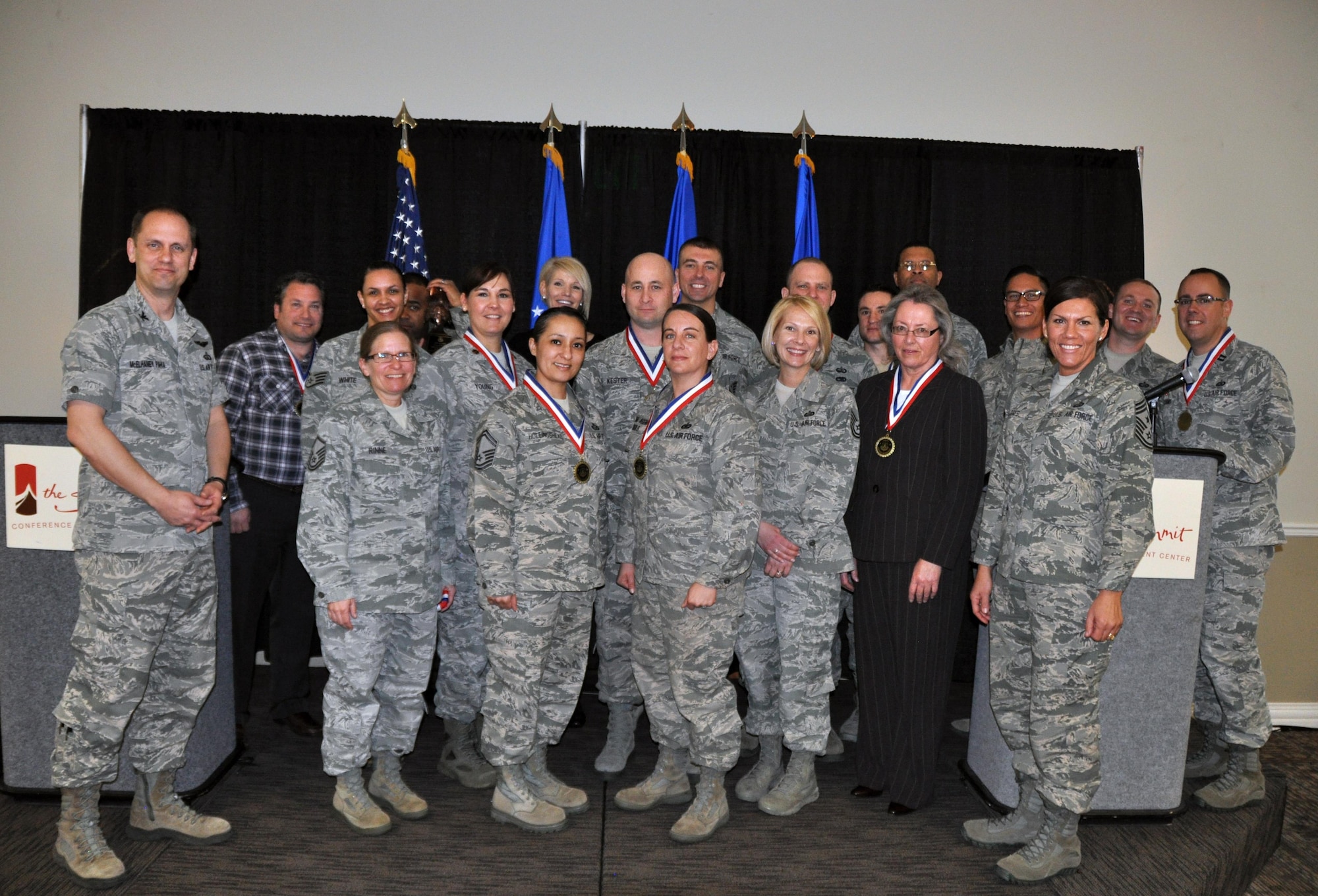 Col. Sean McElhaney Pahia, Air Reserve Personnel Center vice commander, and Chief Master Sgt. Ruthe Flores, ARPC command chief, honored ARPC’s 2014 outstanding performers of the year as well as their A1 annual award winners at the Summit Conference and Event Center Feb. 24, 2015, in Denver. (U.S. Air Force photo/Tech. Sgt. Rob Hazelett)