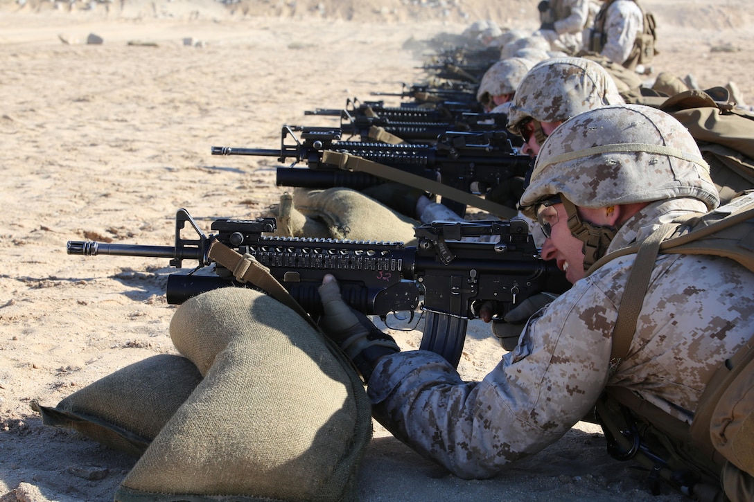 Grenadiers with Company A, Ground Combat Element Integrated Task Force, fire the M16A4 rifle/M203 grenade launcher during a zeroing exercise at Range 106, Marine Corps Air Ground Combat Center Twentynine Palms, California, Feb. 24, 2015. From October 2014 to July 2015, the GCEITF will conduct individual and collective level skills training in designated ground combat arms occupational specialties in order to facilitate the standards-based assessment of the physical performance of Marines in a simulated operating environment performing specific ground combat arms tasks. (U.S. Marine Corps photo by Sgt. Alicia R. Leaders/Released)