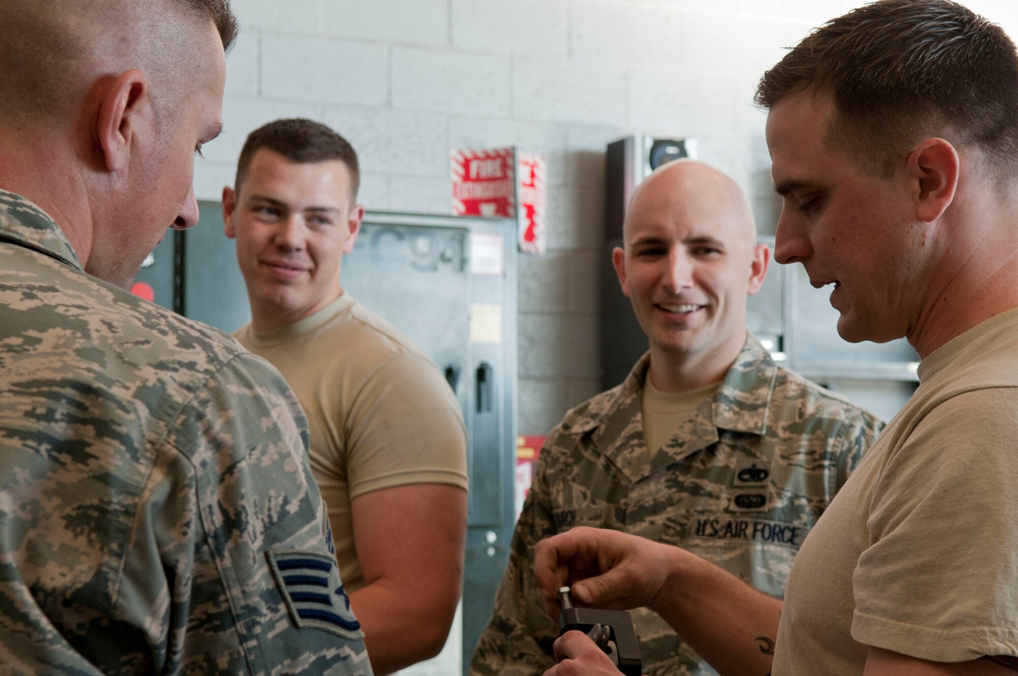 Airmen assigned to the 823rd Maintenance Squadron prepare for a shift change at the 823rd MXS maintenance hangar on Nellis Air Force Base, Nev., Feb. 24, 2015. The HH-60G is tasked to perform military operations other than war, including civil search and rescue, medical evacuation, disaster response, humanitarian assistance, security cooperation and aviation advisory, NASA space flight support, and rescue command and control. (U.S. Air Force photo by Airman 1st Class Mikaley Towle)