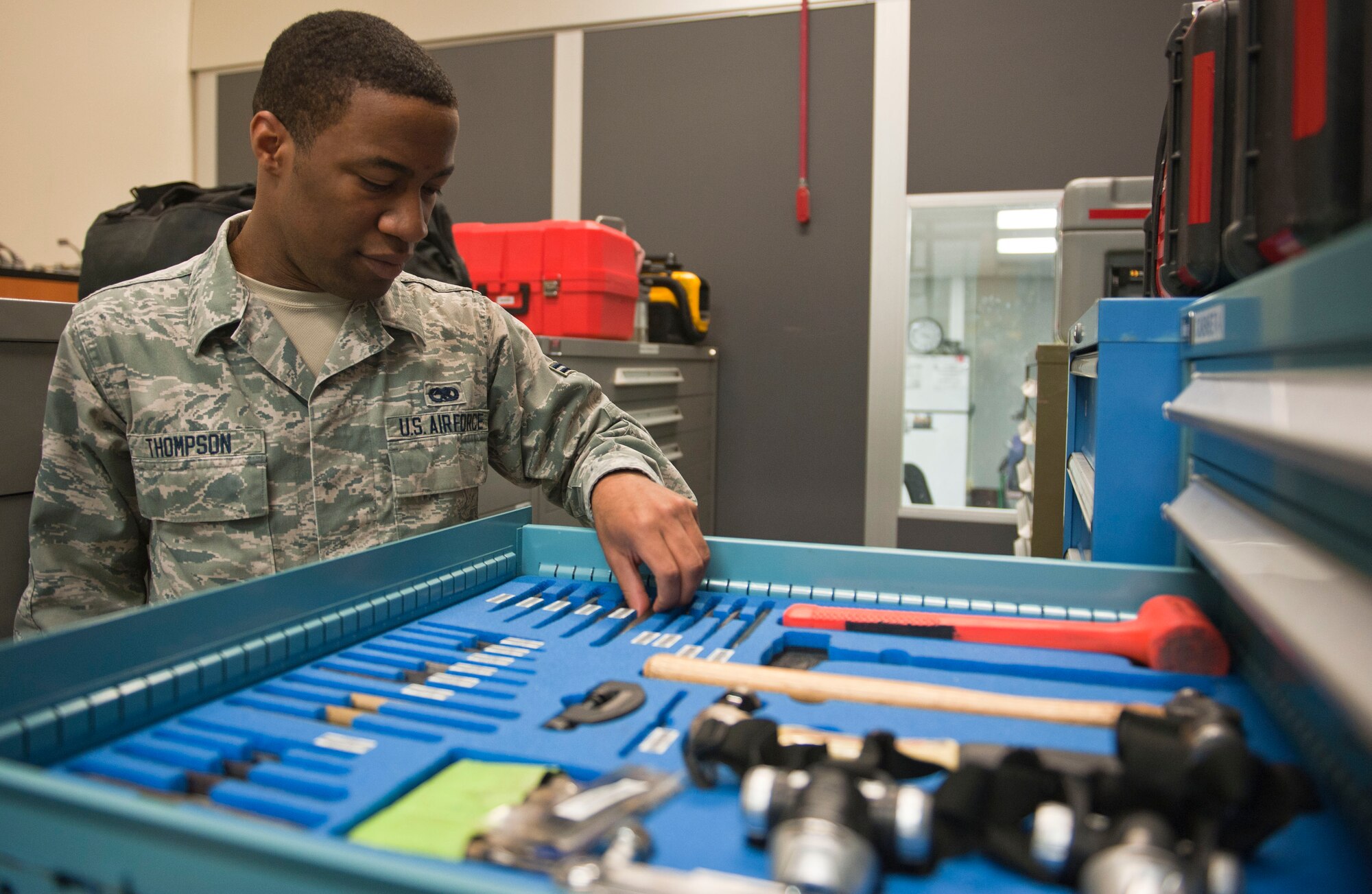 Airman 1st Class Carter Thompson, 823rd Maintenance Squadron non-destructive inspector, ensures tools are accounted for in the 823rd MXS maintenance hangar at Nellis Air Force Base, Nev., Feb. 24, 2015. The 823rd MXS plans, schedules and directs both scheduled and unscheduled maintenance and preventative maintenance to maintain the aircraft’s mission-ready status. (U.S. Air Force photo by Senior Airman Thomas Spangler) 