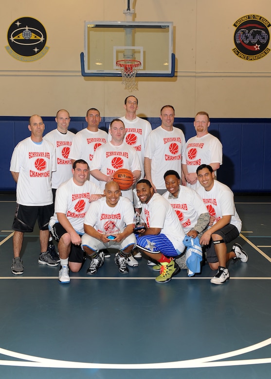 Team Space Innovation and Development Center members pose with the intramural basketball championship trophies following their 54-44 victory over 3rd Space Operations Squadron in the championship game. In addition to winning the championship, SIDC finished the season a perfect 16-0. (U.S. Air Force photo/Dennis Rogers)