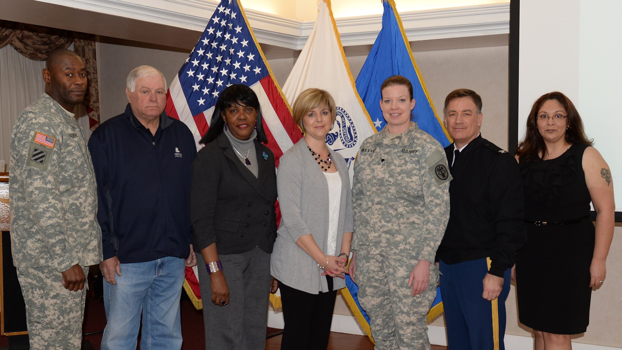 U.S. Army Sgt. Maj. James Jackson, 733rd Mission Support Group command sergeant major and Col. William Galbraith, 733rd MSG commander, recognized volunteers during a quarterly ceremony hosted at Fort Eustis, Va., Feb. 24, 2015. The winners included Larry Sigmon from Outdoor Recreation, Shirley Smith from the Military Personnel Branch, Mendie Pedigo from the Fort Eustis Spouses' Club, Spc. Stacy Mulvaney from the Regimental Memorial Chapel and Raquel Tamayo from Army Community Service. (U.S. Air Force photo by Staff Sgt. Teresa J. Cleveland/Released)